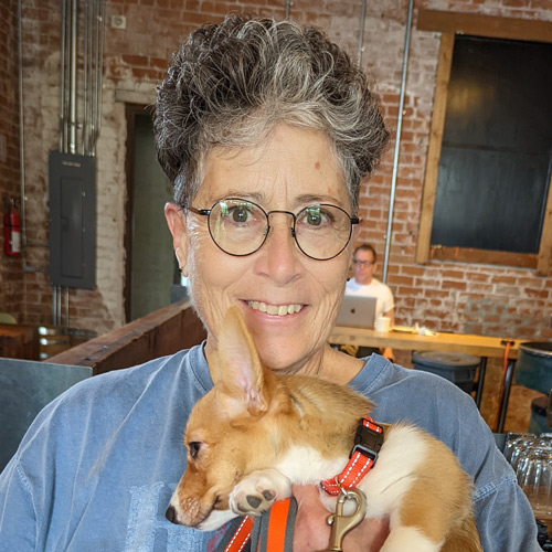 Carol holding her puppy Elizabeth.